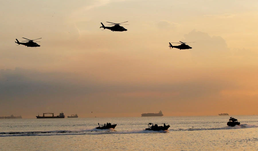 Philippine Navy helicopters and assault vessels simulate a rescue operation during the 120th anniversary celebration of the Philippine Navy, in this fiel photo taken May 22, 2018 in suburban Pasay city south of Manila, Philippines. (AP)