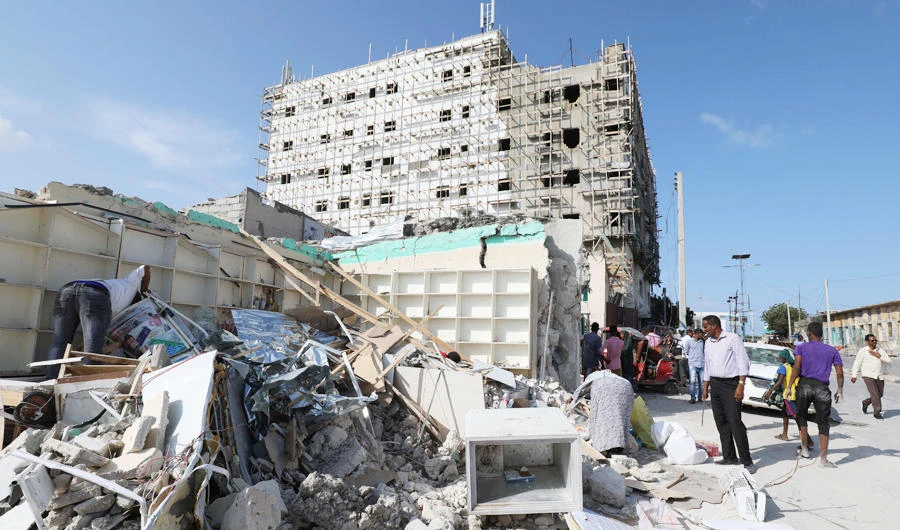 A general view shows people at the scene of a suicide car explosion at a check point near Somali Parliament building in Mogadishu, Somalia June 15, 2019. (REUTERS)