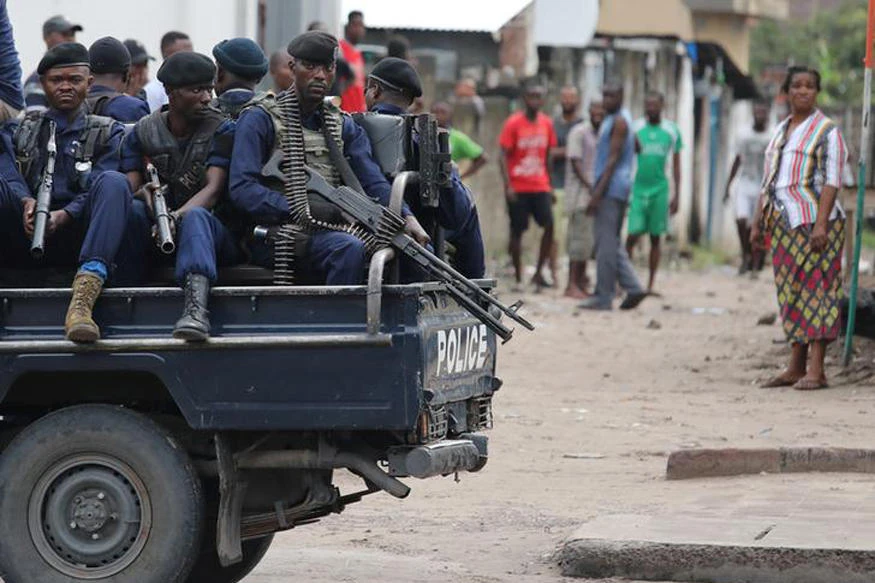 Police sit in a pickup vehicle in front of Notre Dame Cathedral in Kinshasa, Democratic Republic of Congo. (Reuters)