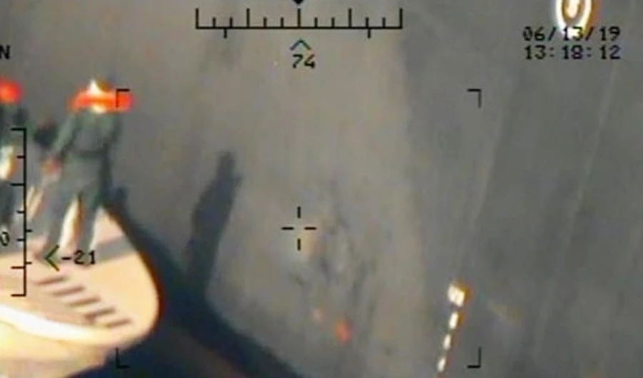 A U.S. military image released by the Pentagon in Washington on June 17, which is says was taken from a U.S. Navy MH-60R helicopter in the Gulf of Oman in waters between Gulf Arab states and Iran on June 13, shows personnel that the Pentagon says are members of the Islamic Revolutionary Guard Corps Navy leaving after removing an unexploded limpet mine from the M/T Kokuka Courageous, a Japanese owned commercial motor tanker. (Reuters)