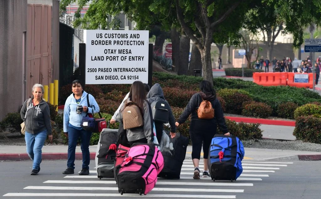 The US is facing a surge in migrant arrivals from impoverished Central American countries and has overwhelmed the ability of authorities to temporarily shelter and process them. (AFP)