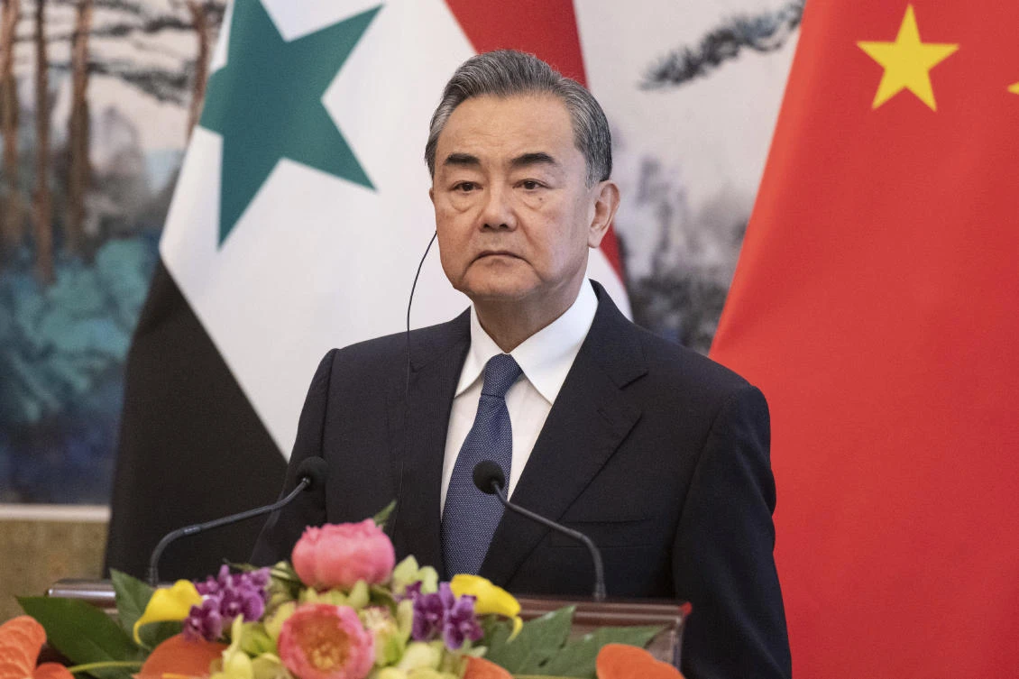 China's Foreign Minister Wang Yi speaks to media after a meeting with Syrian Foreign Minister Walid Muallem at the Diaoyutai state guesthouse, Tuesday, June 18, 2019. (AP)