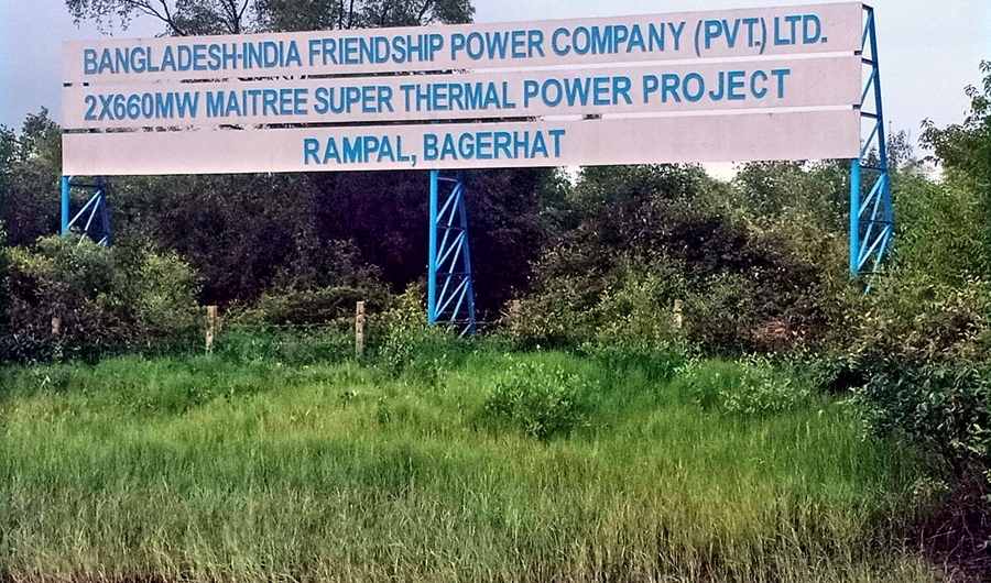 The signboard of the under-construction coal-based Rampal power plant, established on the bank of the Poshur River, close to Sundarbans, which led the UNESCO to put the mangrove forest on the danger list of world heritage sites. (AN photo by Shehab Sumon)