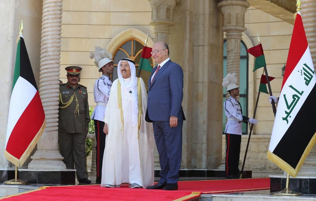 Iraqi President Barham Saleh, right, welcomed Emir Sheikh Sabah Al Ahmad Al Sabah for the first official visit since 2012. (AFP)