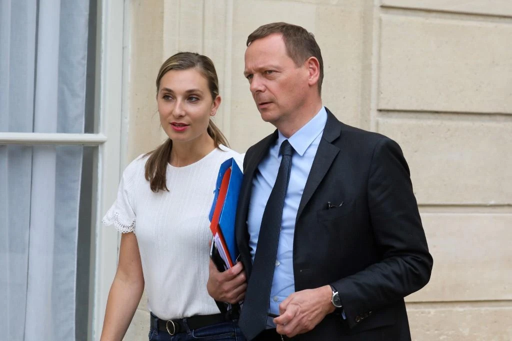 Presidential press advisor Nathalie Baudon, left, and diplomatic advisor Emmanuel Bonne stand in the court of the Elysee Palace in Paris. (AFP file photo)
