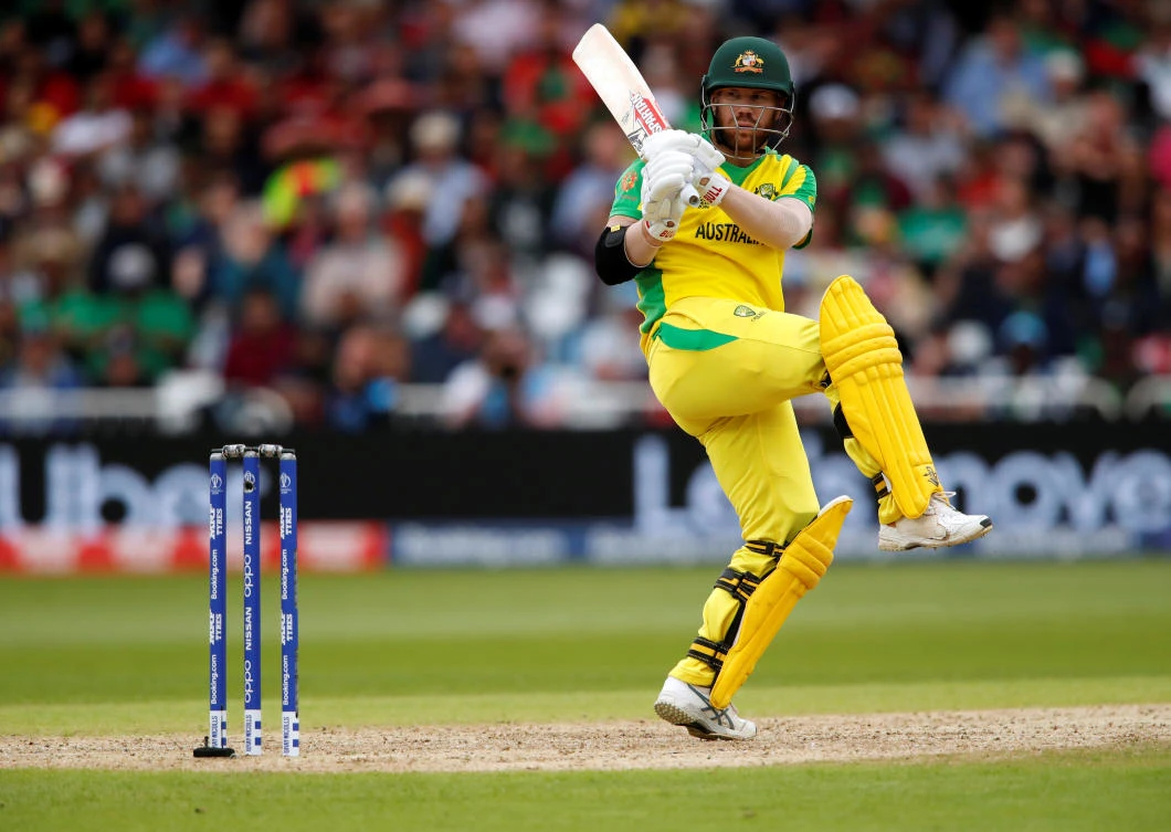 Warner ton against Bangladesh sends Australia top of World Cup table