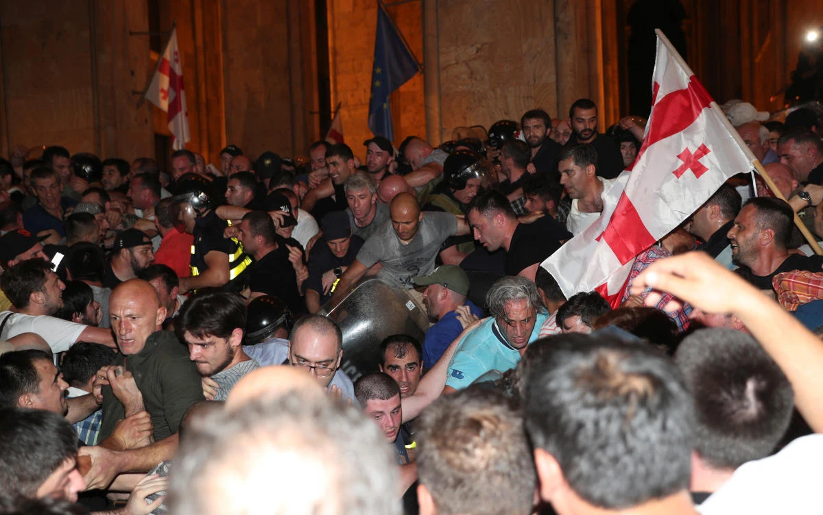 Thousands of protesters try to storm Georgia parliament