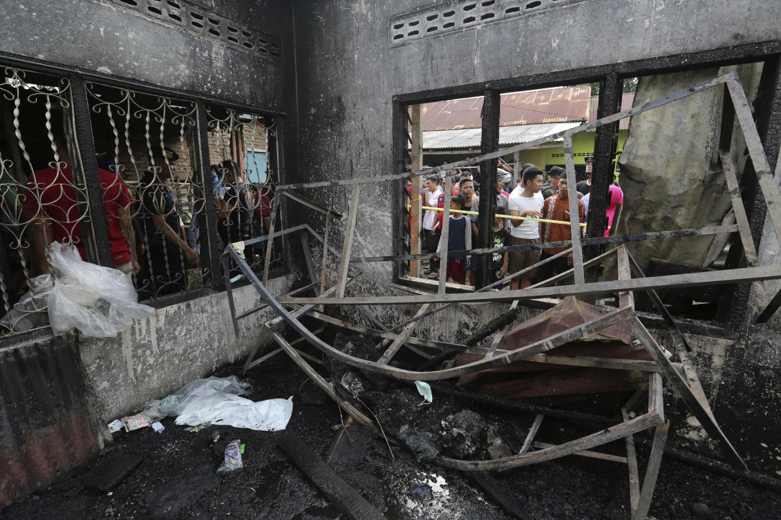 A number of people including children were killed in the fire that swept through a house that doubled as a match factory in Langkat, North Sumatra, Indonesia. (AP)