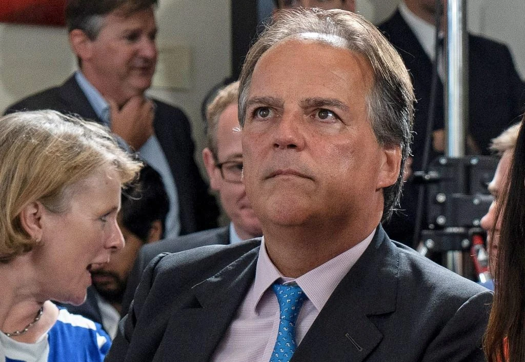 Junior Foreign Office minister Mark Field accosted the female activist as she walked toward finance minister Phillip Hammond. (AFP)