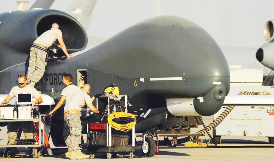 US Air Force maintainers prepare a US military drone RQ-4A Global Hawk for takeoff at an undisclosed location in Southwest Asia. (Reuters)