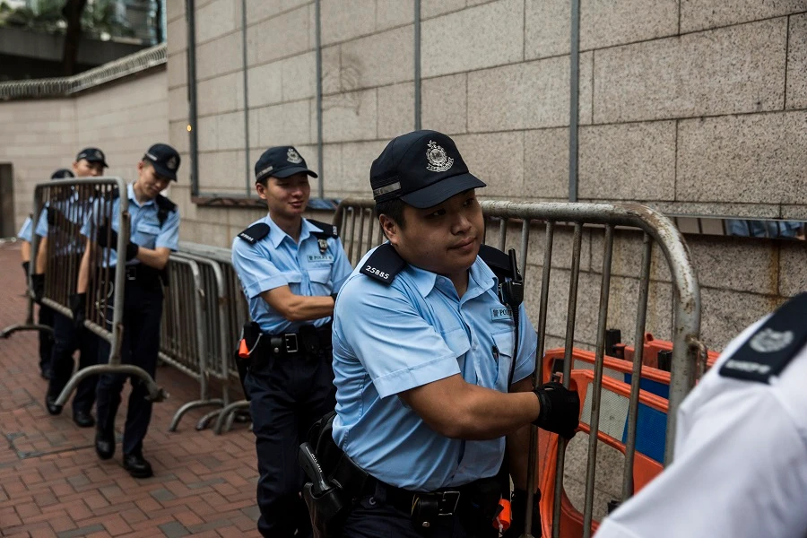 Hong Kong police vow to pursue HQ siege protesters
