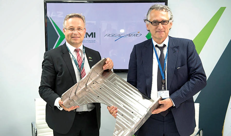Saudi Arabian Military Industries CEO Andreas Scheuer and Jean-Claude Mayar, the chairman and CEO of Figeac Aéro, sign a joint venture to build an airframe-manufacturing facility in Saudi Arabia. (SPA)
