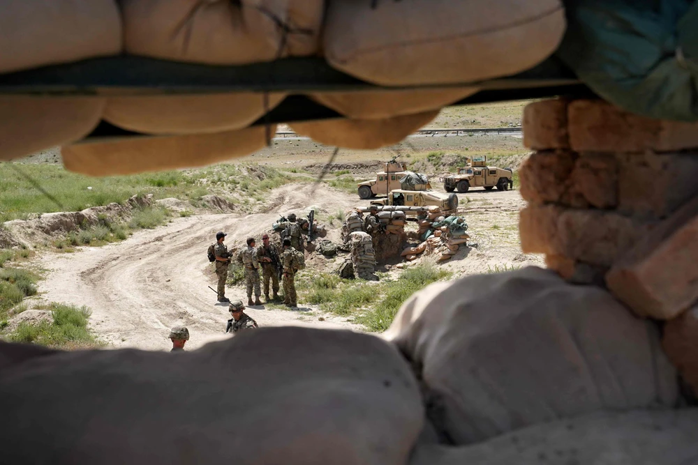 US troops are seen through a firing position at the Afghan National Army (ANA) checkpoint in Nerkh district of Wardak province west of Kabul. (AFP file photo)