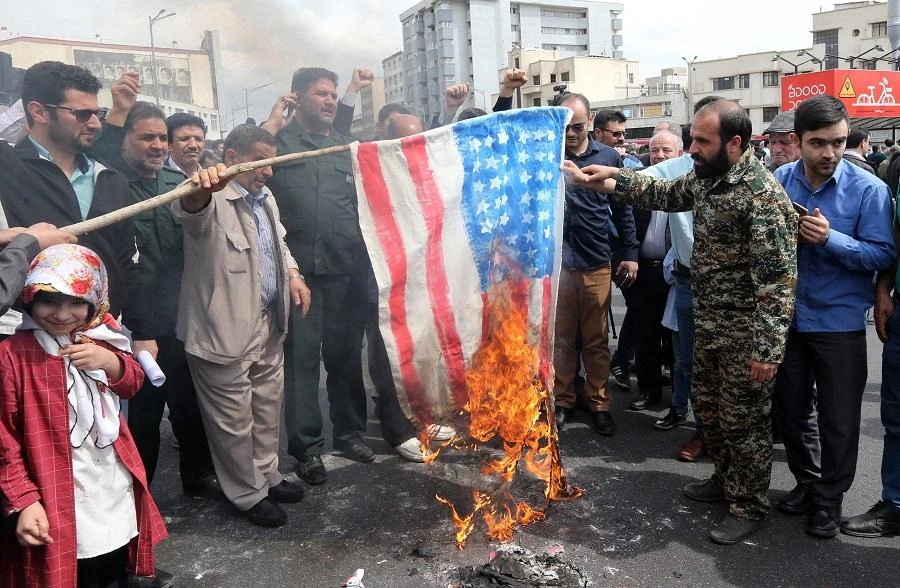Iranians set ablaze a US flag during an anti-US rally following Friday prayers in Tehran on April 12 2019. (File/AFP)