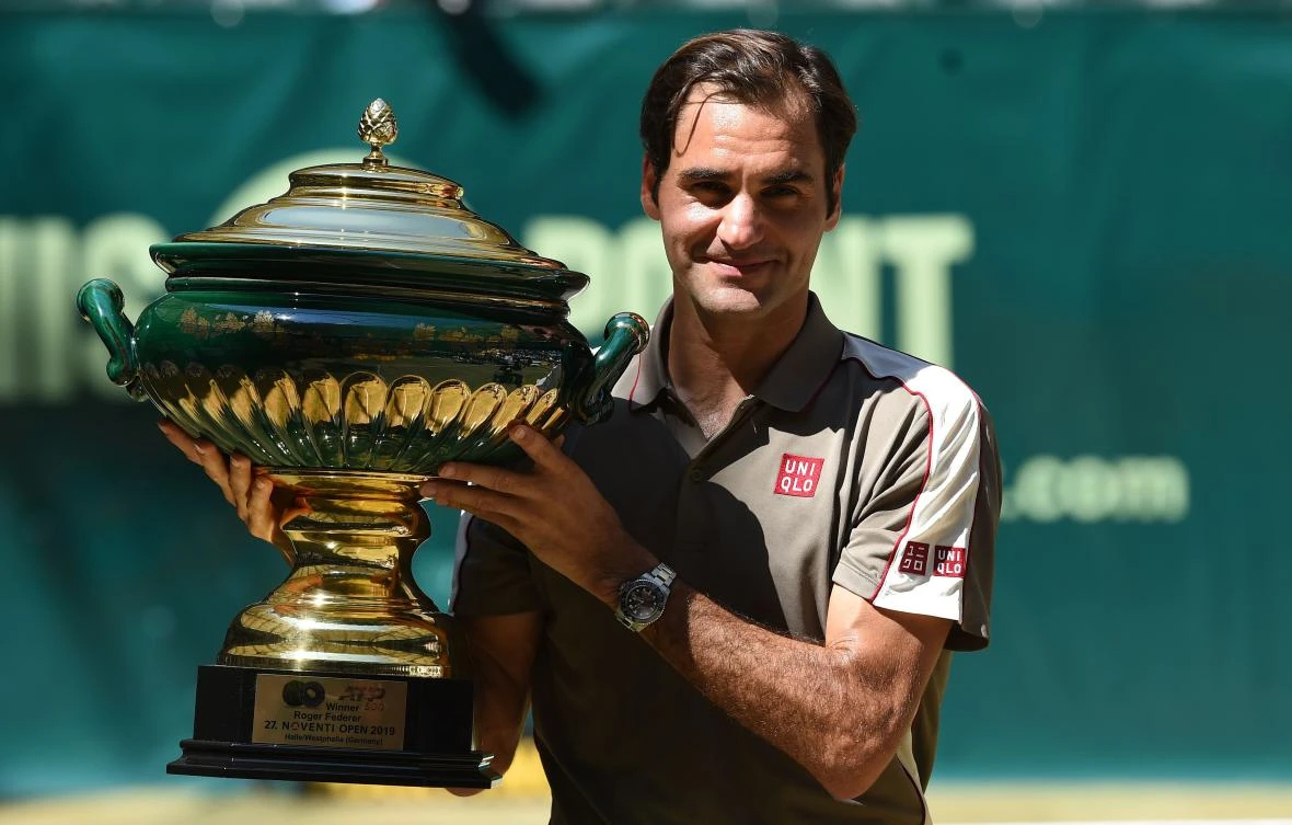 Roger Federer poses with the trophy after he won his final match against David Goffin from Belgium at the ATP tennis tournament in Halle. (AFP)