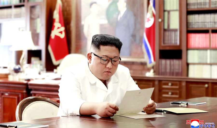 This undated and unlocated picture released from North Korea's official Korean Central News Agency (KCNA)on June 23, 2019 shows North Korean leader Kim Jong Un reading a personal letter from President of the United States of America Donald Trump. (AFP)