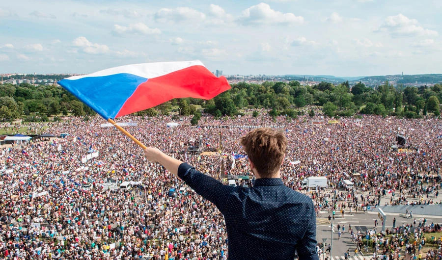 A man holds a Czech National flag during a rally demanding the resignation of Czech Prime Minister Andrej Babis on June 23, 2019 in Prague. (AFP)