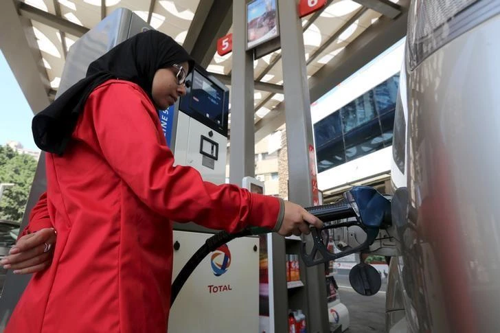 An attendant fills the tank of a car at a petrol station in Cairo, Egypt. (Reuters)