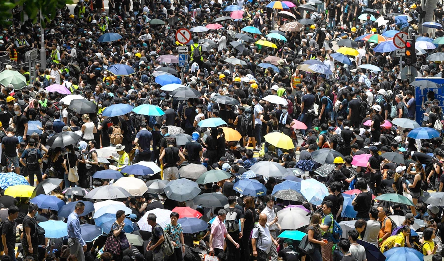 Image Caption : Protesters gather on a road outside the police headquarters in Hong Kong. (AFP)