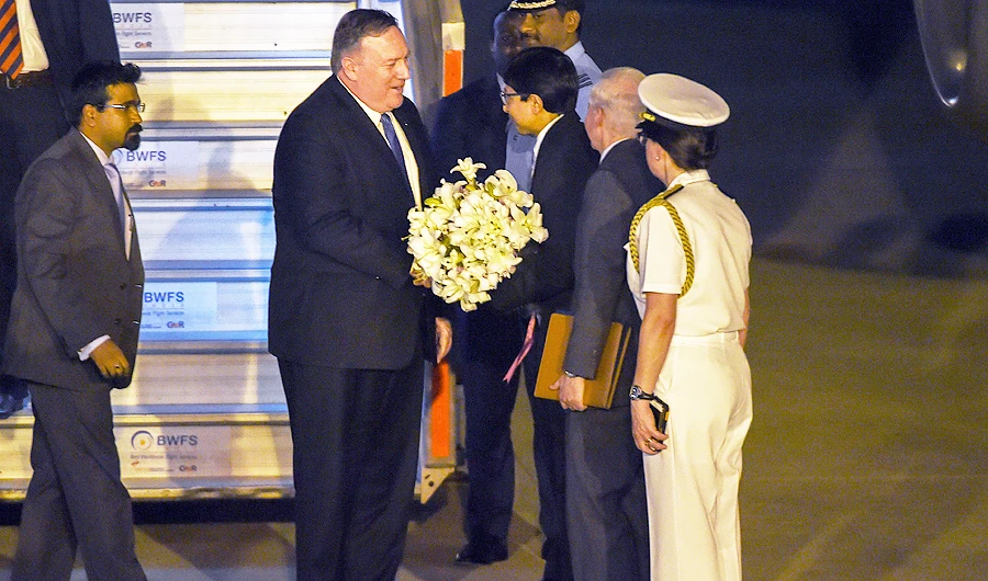 US Secretary of State Mike Pompeo is welcomed with a flower bouquet upon his arrival at the Palam technical airport in New Delhi