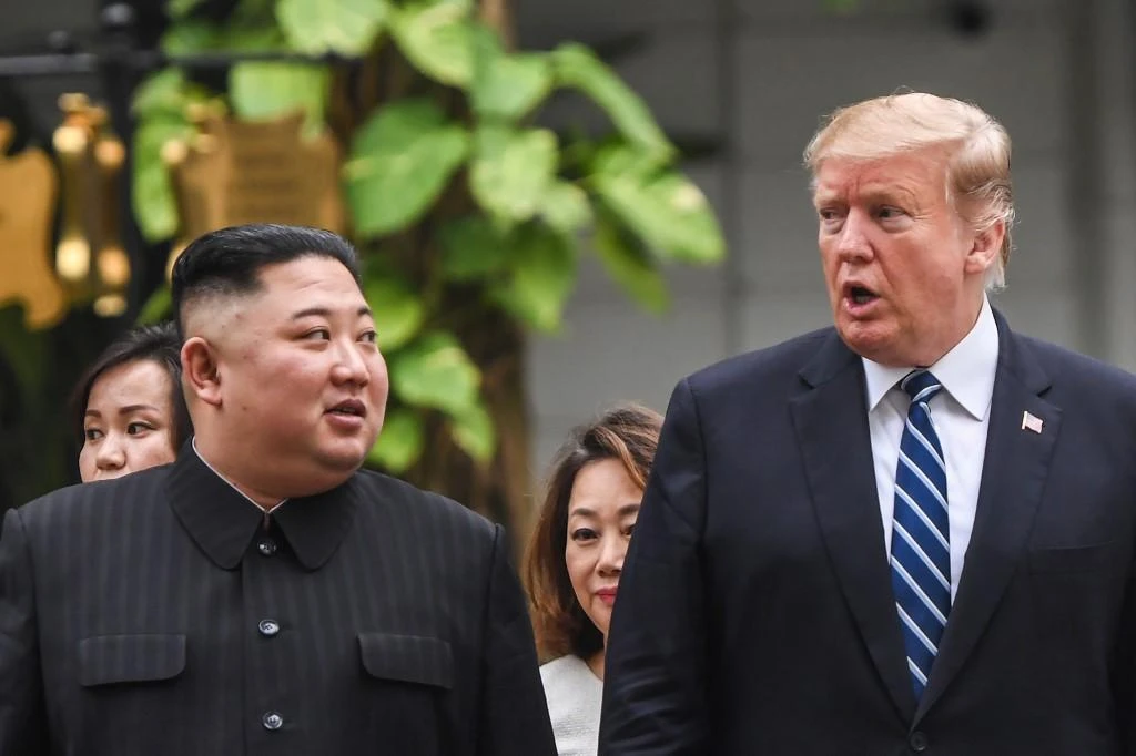 US President Donald Trump, right, walks with North Korean leader Kim Jong Un during a break in their talks in Hanoi on February 28, 2019. (AFP)