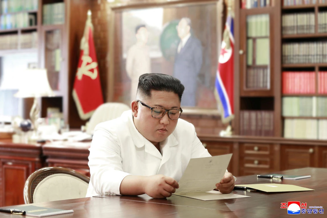 North Korean leader Kim Jong Un reads a letter from US President Donald Trump in Pyongyang in this picture released by North Korea’s Korean Central News Agency on June 22, 2019. (KCNA via Reuters)