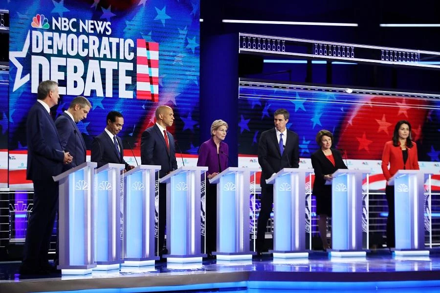 Democratic presidential candidates New York City Mayor Bill De Blasio (L-R), Rep. Tim Ryan (D-OH), former housing secretary Julian Castro, Sen. Cory Booker (D-NJ), Sen. Elizabeth Warren (D-MA), former Texas congressman Beto O'Rourke, Sen. Amy Klobuchar (D-MN) and Rep. Tulsi Gabbard (D-HI) take part in the first night of the Democratic presidential debate on June 26, 2019 in Miami. (AFP)