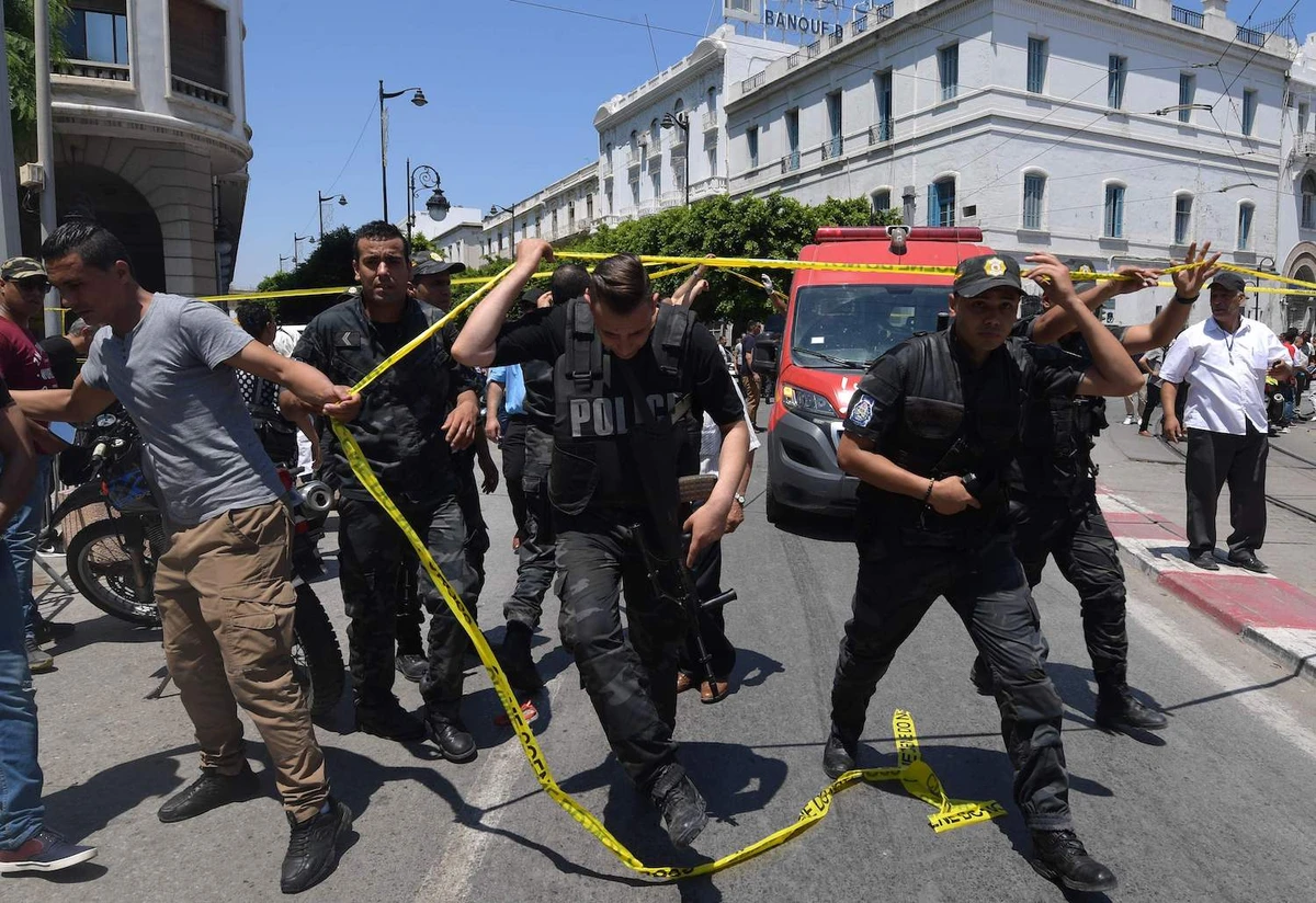 Tunisian police work at the site of an attack in the Tunisian capital's main avenue Habib Bourguiba on June 27, 2019. (AFP)