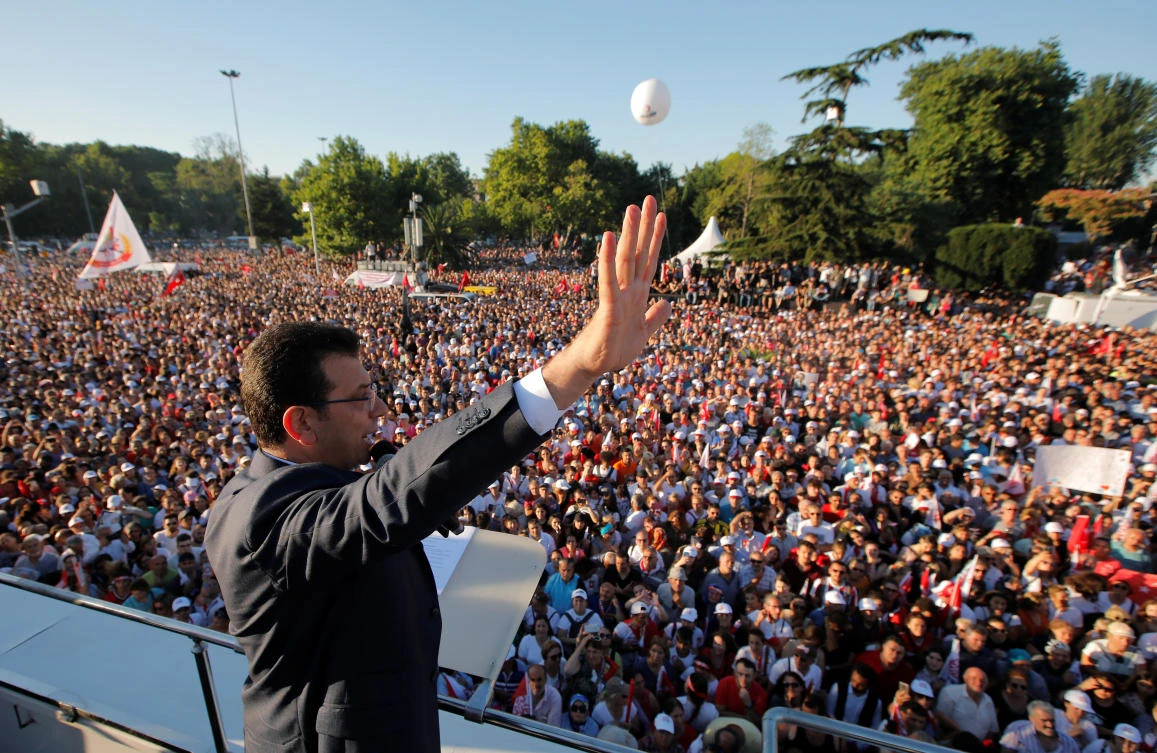 Mayor of Istanbul Ekrem Imamoglu of the main opposition Republican People's Party (CHP) gestures as he addresses his supporters from the top of a bus outside the City Hall in Istanbul, Turkey, on Thursday. (Reuters)