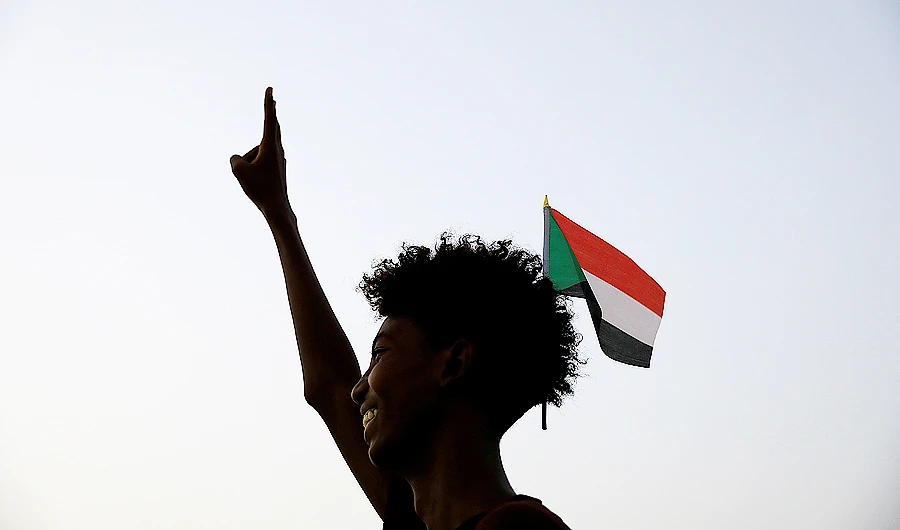 A Sudanese demonstrator makes a victory sign during a demonstration in Khartoum. (Reuters)