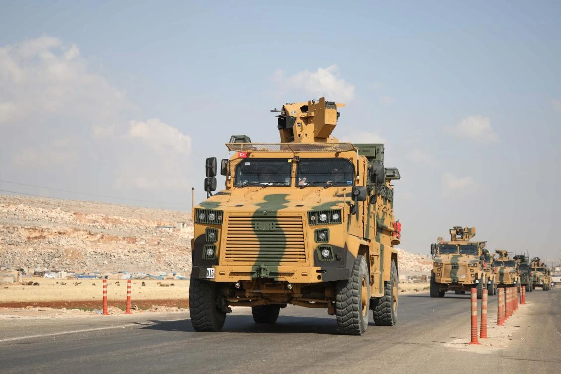 A convoy of Turkish armored vehicles drive toward Bab Al-Hawa crossing point between Syria and Turkey on a highway in the northern countryside of the Syrian province of Idlib on June 20, 2019. (AFP)