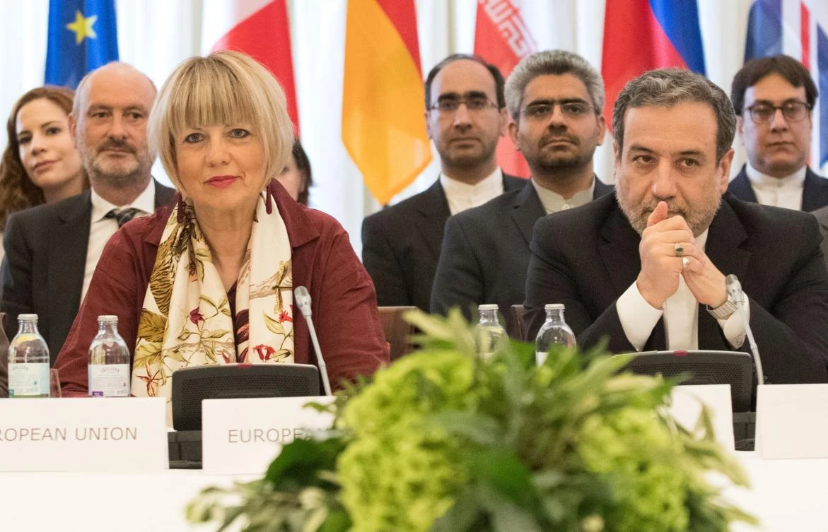 Abbas Araghchi (R), political deputy at the Ministry of Foreign Affairs of Iran, and Helga Schmid (L), Secretary General of the European Union's External Action Service (EEAS), take part in a meeting of the JCPOA attended by the E3+2 and Iran on June 28, 2019 in Vienna, Austria. (AFP)