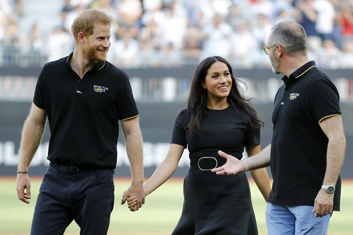 Britain's Prince Harry, Duke of Sussex and Britain's Meghan, Duchess of Sussex arrive on the field prior to the start of the first of a two-game series between the New York Yankees and the Boston Red Sox at London Stadium in Queen Elizabeth Olympic Park, east London on June 29, 2019. (AFP)