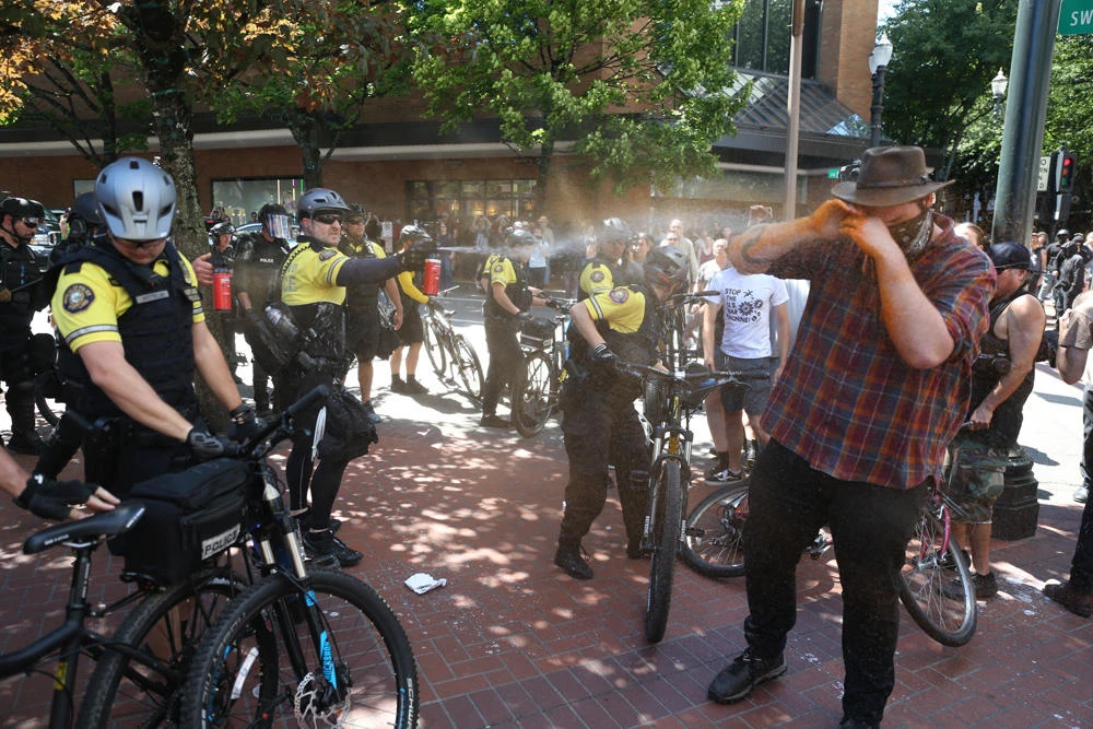 Marches by far-right, anti-fascist groups lead to clashes in US