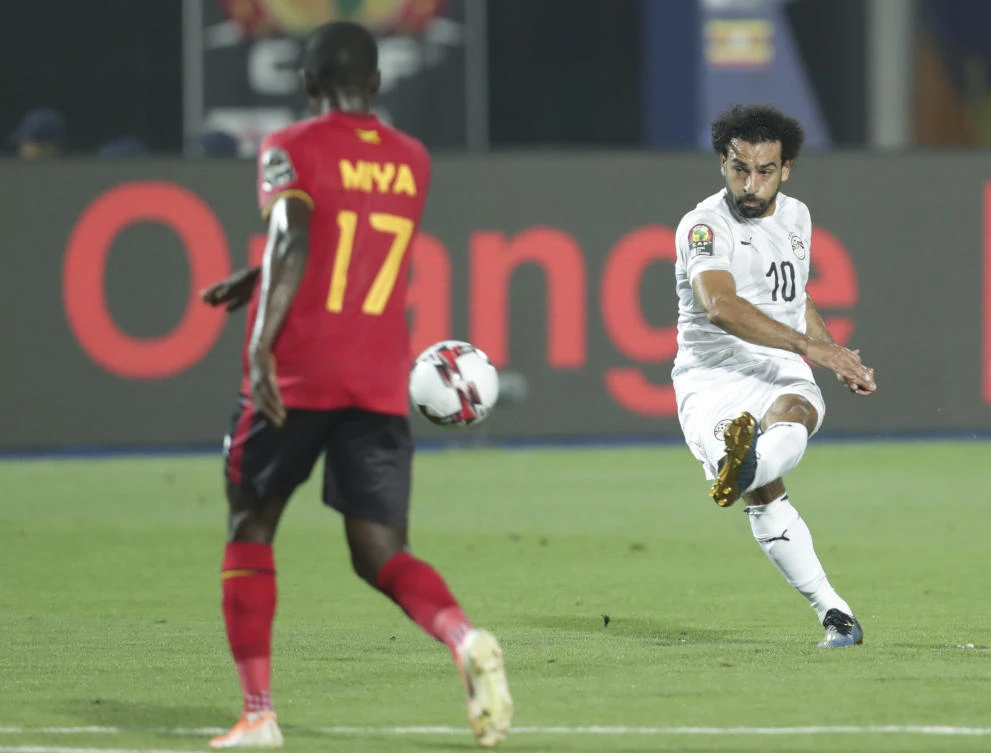 Egypt's Mohamed Salah scores during his country's African Cup of Nations group A match against Uganda in Cairo, Egypt. (AP)