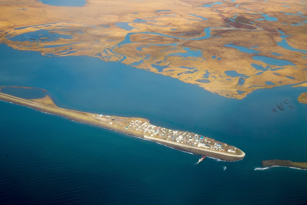 This Sept. 2, 2015, file aerial photo shows the island village of Kivalina, an Alaska Native community of 400 people. Northern Alaska coastal communities and climate scientists say sea ice disappeared far earlier than normal this spring and it's affecting wildlife. (AP Photo/Andrew Harnik, File)