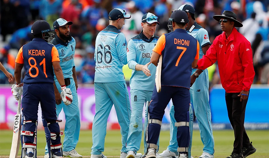 England's Eoin Morgan shakes hands with India's MS Dhoni after the match at Edgbaston, Birmingham, Britain on June 30, 2019. (Reuters)