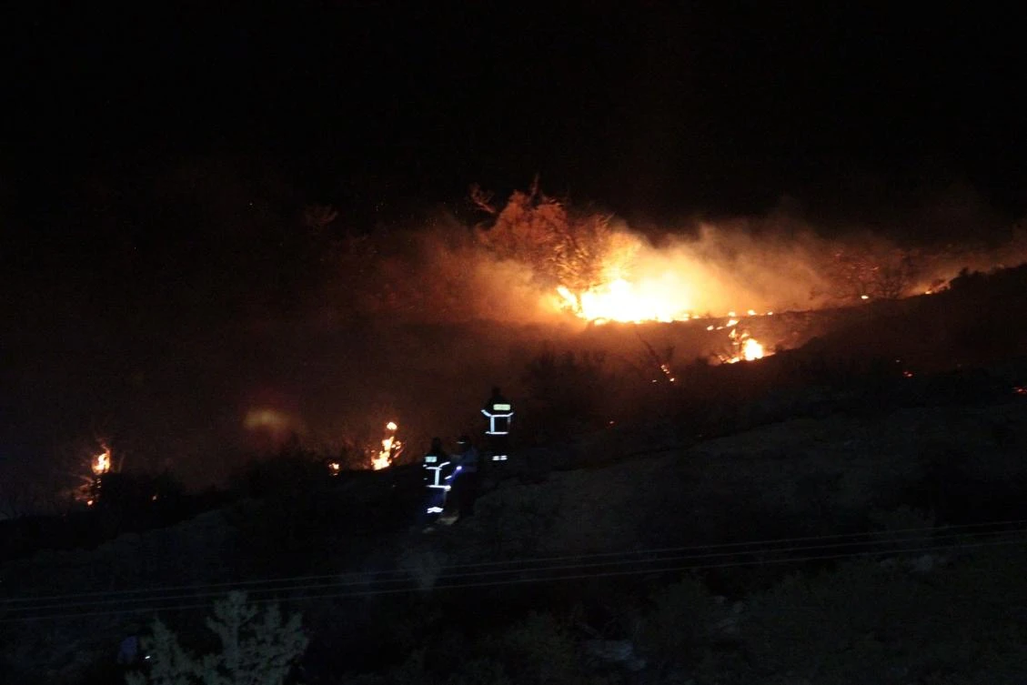 Fire is seen on a hillside where officials said was caused by a suspected Russian missile that exploded overnight on July 1, 2019, in the northern part of the divided island of Cyprus, during an Israeli aerial raid in Syria. (AFP)