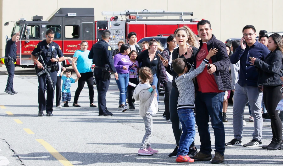 Shoppers hug after being escorted from the Tanforan Mall in San Bruno, Calif., Tuesday, July 2, 2019. (AP)