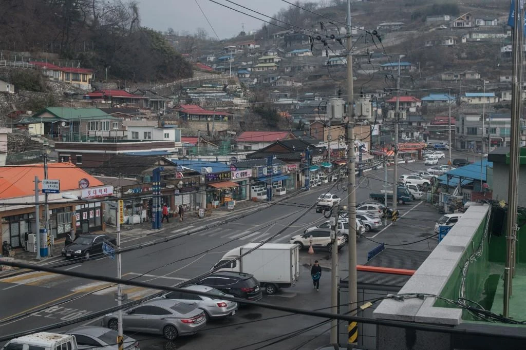 The North Korean fishing boat docked at the South Korean port of Samcheok, above, on June 15 with the four fishermen aboard expecting to face security forces, who name came. (AFP)