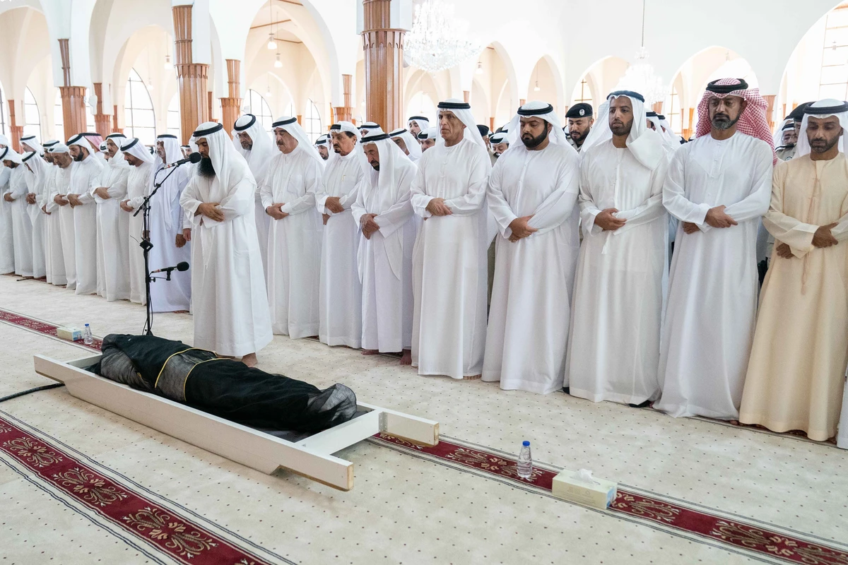 The ruler of Sharjah and other dignitaries perform the funeral prayer for Sheikh Khalid bin Sultan Al-Qasimi. (WAM)