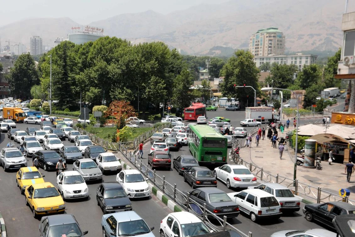 Cars drive through a busy road in the Iranian capital Tehran on July 3, 2019. (AFP)