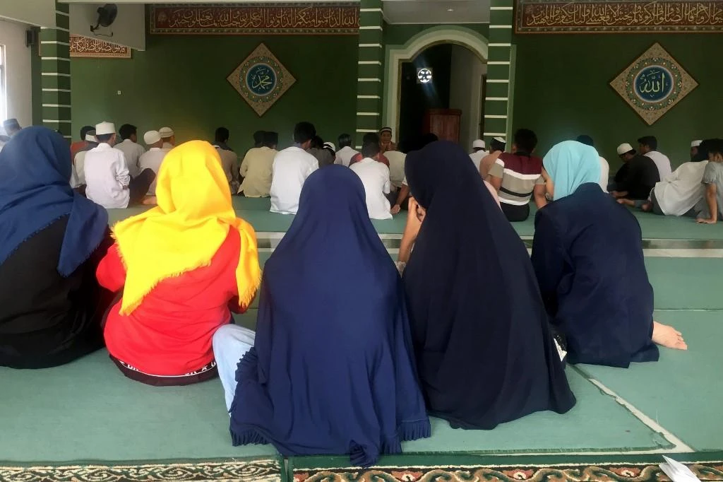 Social workers teach children that Quran is the foundation for everything, but they can't violate other people. (File/AFP_