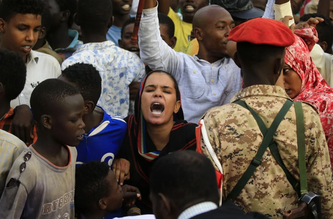 Sudanese protesters chant slogans demanding civilian rule on June 29, 2019 at the end of a rally in Khartoum’s twin city of Omdurman in which the chief of the military council delivered a speech. (AFP)