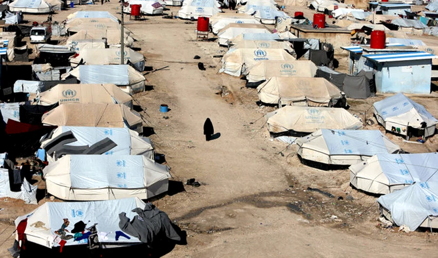 A woman walks through Al-Hol displacement camp in Hasaka governorate, Syria. (Reuters/File)