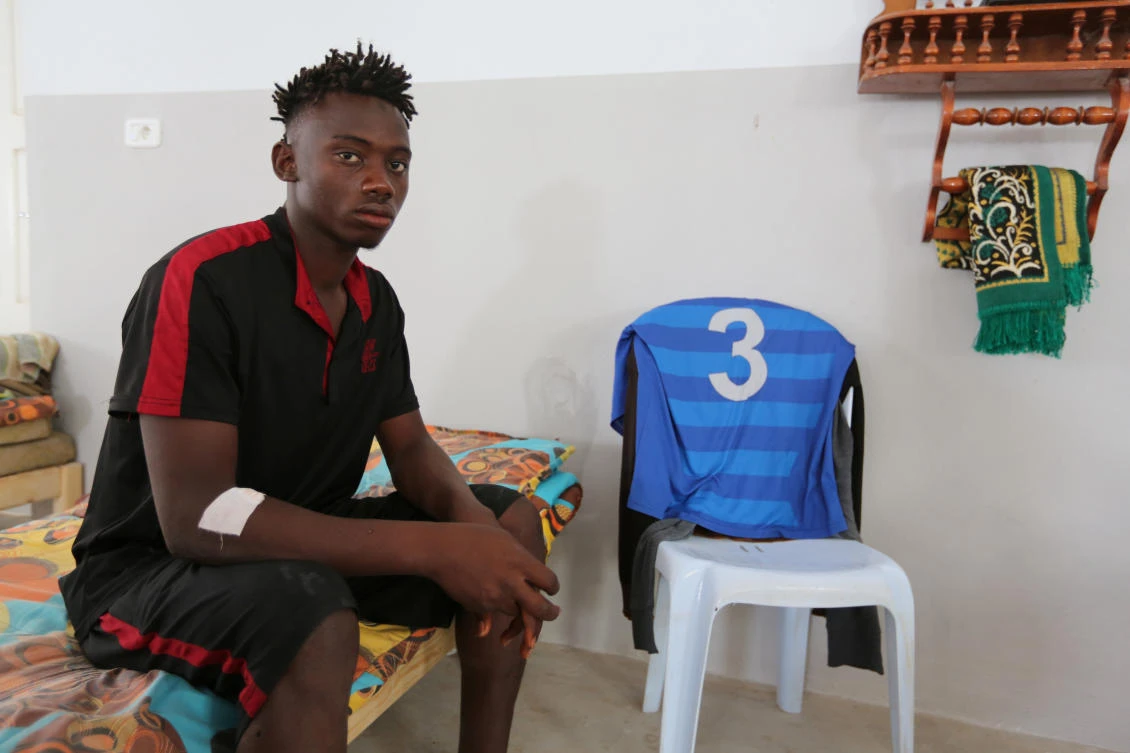 An African migrant who, a government source and the Tunisian Red Crescent said, was rescued after the boat he was travelling capsized in the Mediterranean Sea off the Tunisian Coast, sits inside a local Red Crescent chapter in Zarzis, Tunisia July 4, 2019. (Reuters)