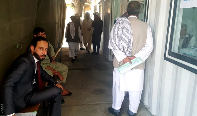 Afghan government officials discuss Hajj preparations at the yard of a center for Hajjis in Kabul on Sunday. This year 30,000 Afghan are set to perform Hajj. (AN photo)