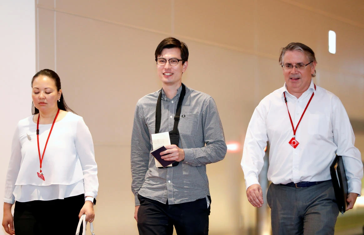 Australian student Alek Sigley, center, who was detained in North Korea, arrives at Haneda International Airport in Tokyo, Japan on July 4, 2019. (Reuters)