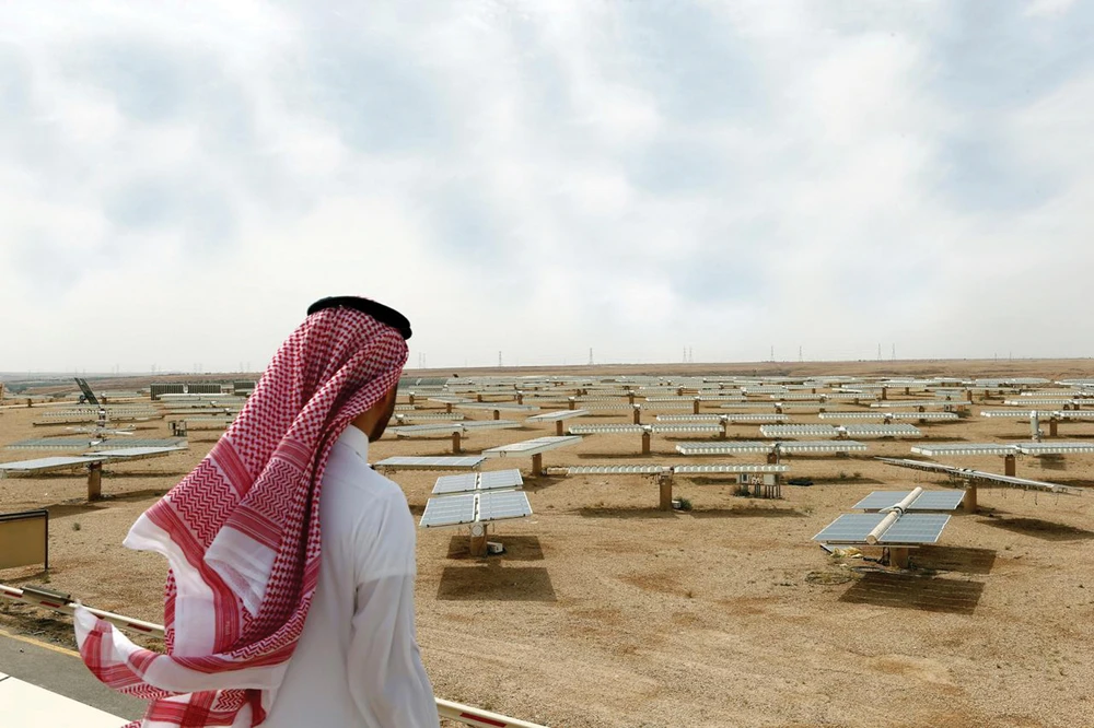 A man looks at the solar plant in Uyayna, north of Riyadh. Experts say that the Saudi renewable-energy market is the largest in the Middle East, with massive capacity expansion. (Reuters)