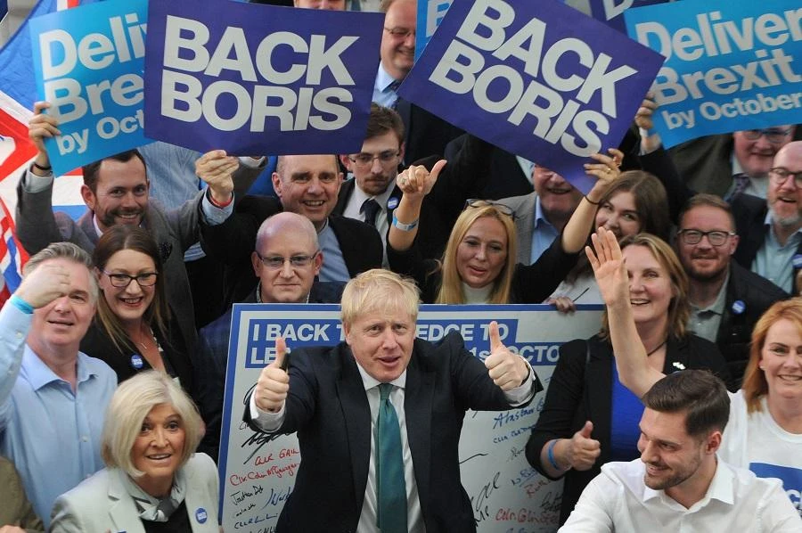 Conservative MP and leadership contender Boris Johnson poses with supporters before a Conservative Party Hustings event in Perth, Scotland, on July 5, 2019. (File/AFP)